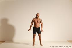 Underwear Gymnastic poses Man Black Muscular Bald Dancing Dynamic poses Academic